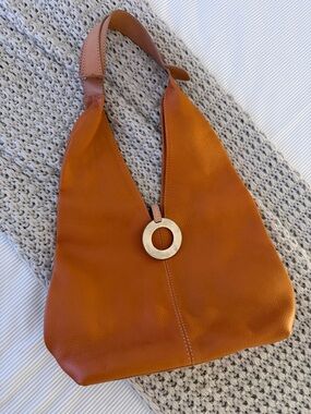 Timeless Orange Leather Hobo with Circular Accent